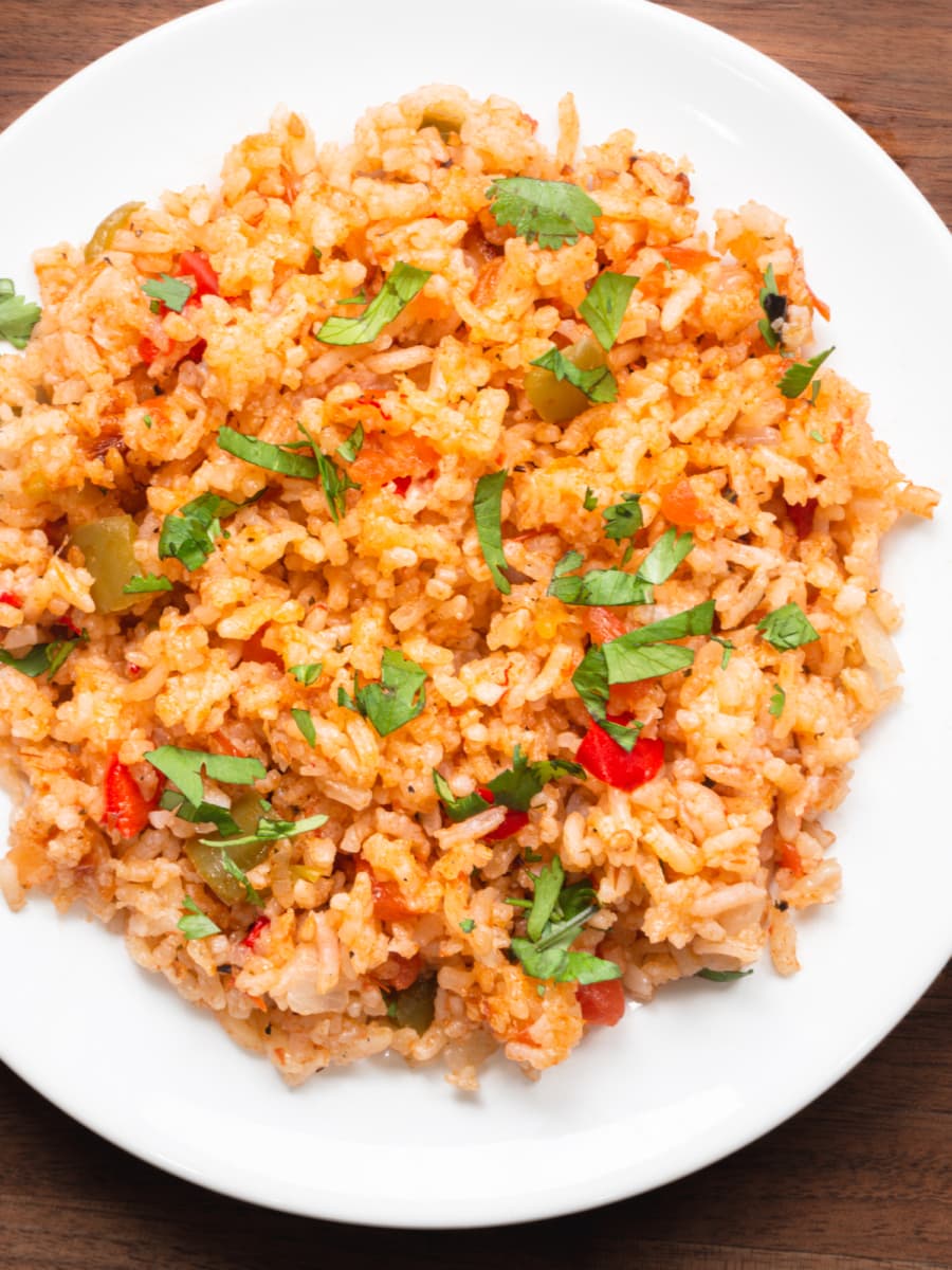 overhead shot of a plate of spanish rice garnished with cilantro