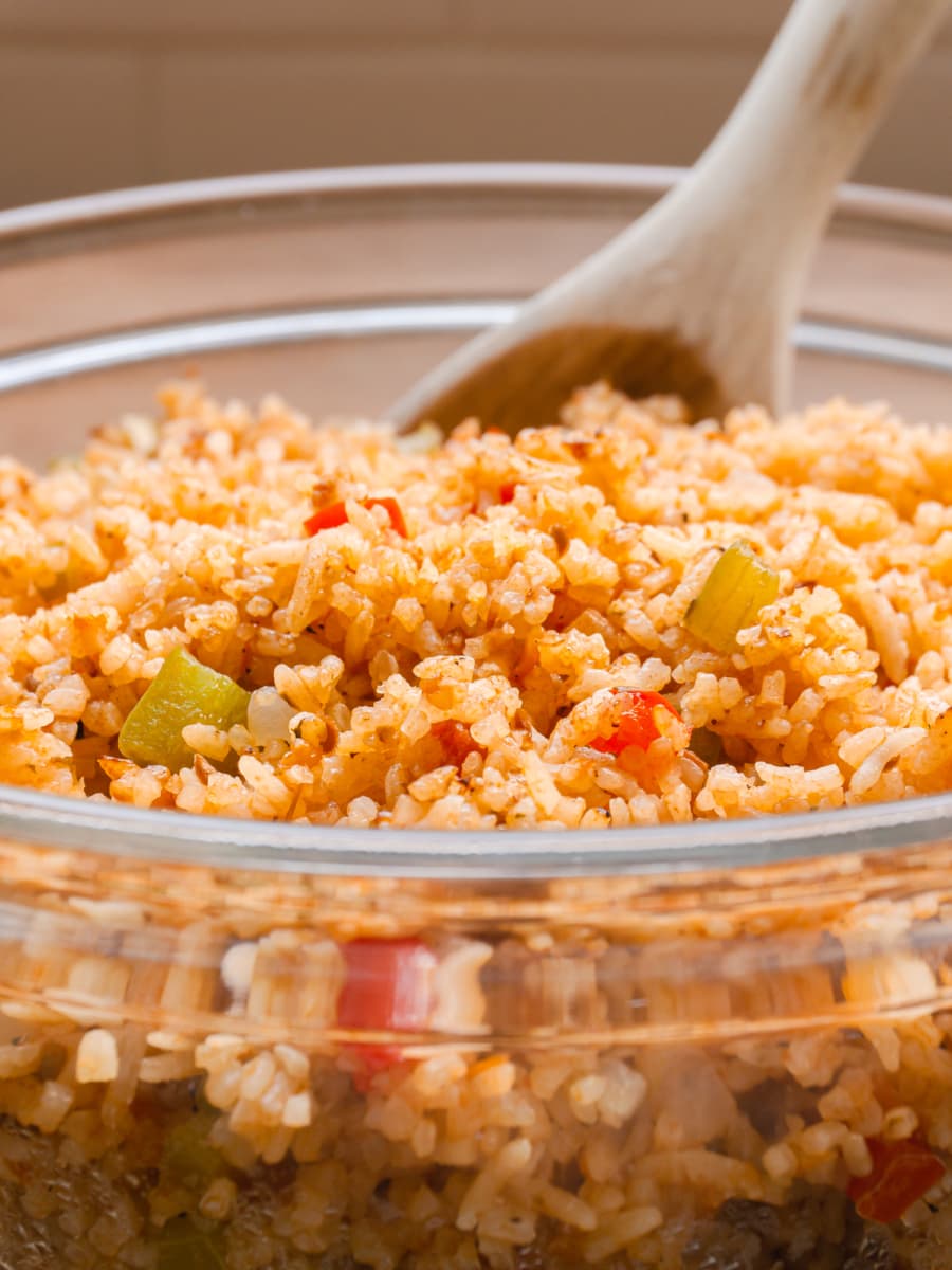 side view of spanish rice in a glass bowl