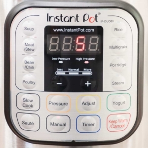 the digital display of the instant pot reading a five minute high pressure cooke time