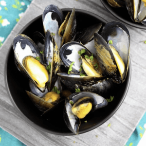 a bowl of cooked mussels