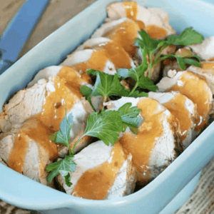 a baking dish of pork tenderloin slices