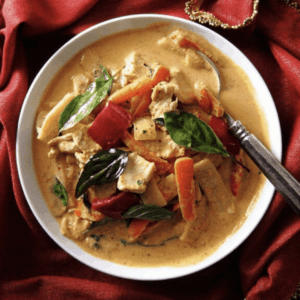 a bowl of thai red curry with chicken