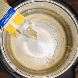 pouring chicken stock into the instant pot