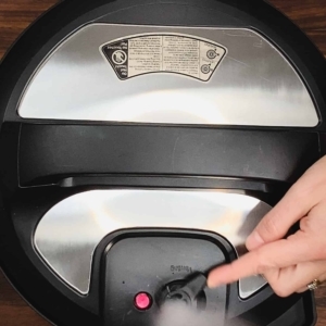 moving the pressure release valve on the instant pot pressure cooker to release pressure from the pot