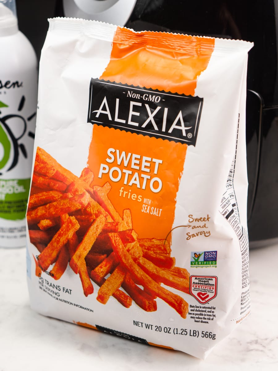 a bag of alexia frozen sweet potato fries with an air fryer in the background