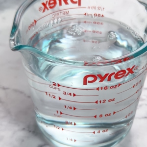 a measuring cup with two cups of water