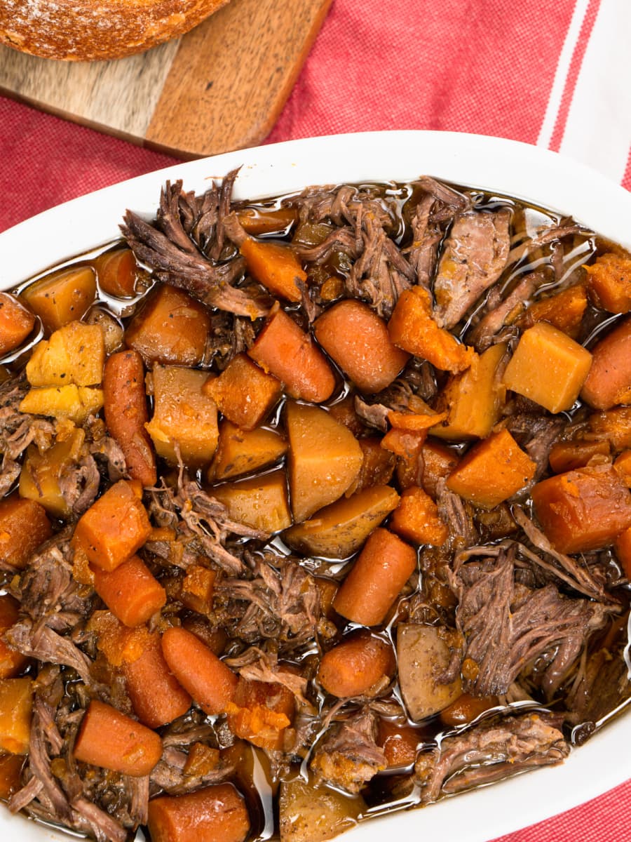 a serving dish with pot roast made in the crock pot slow cooker