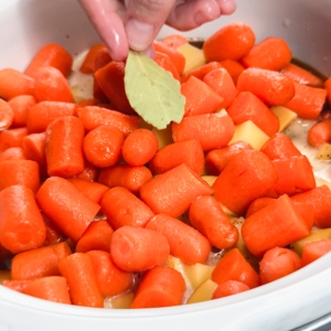 adding a bay leaf to the pot roast ingredient in the slow cooker