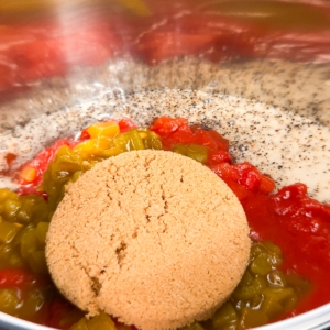 adding brown sugar to the instant pot for making carne mechada