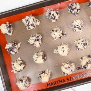 chocolate chip coconut macaroons arranged on a baking sheet