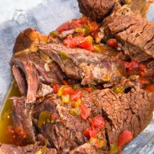 pieces of cooked chuck roast in a serving dish