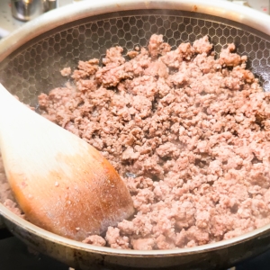 cooked ground beef in a skillet