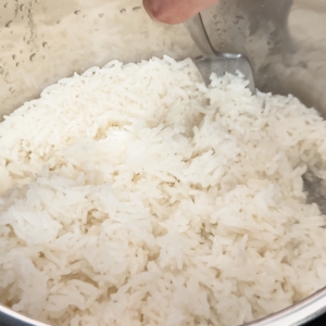 fluffing jasmine rice with a fork in the instant pot