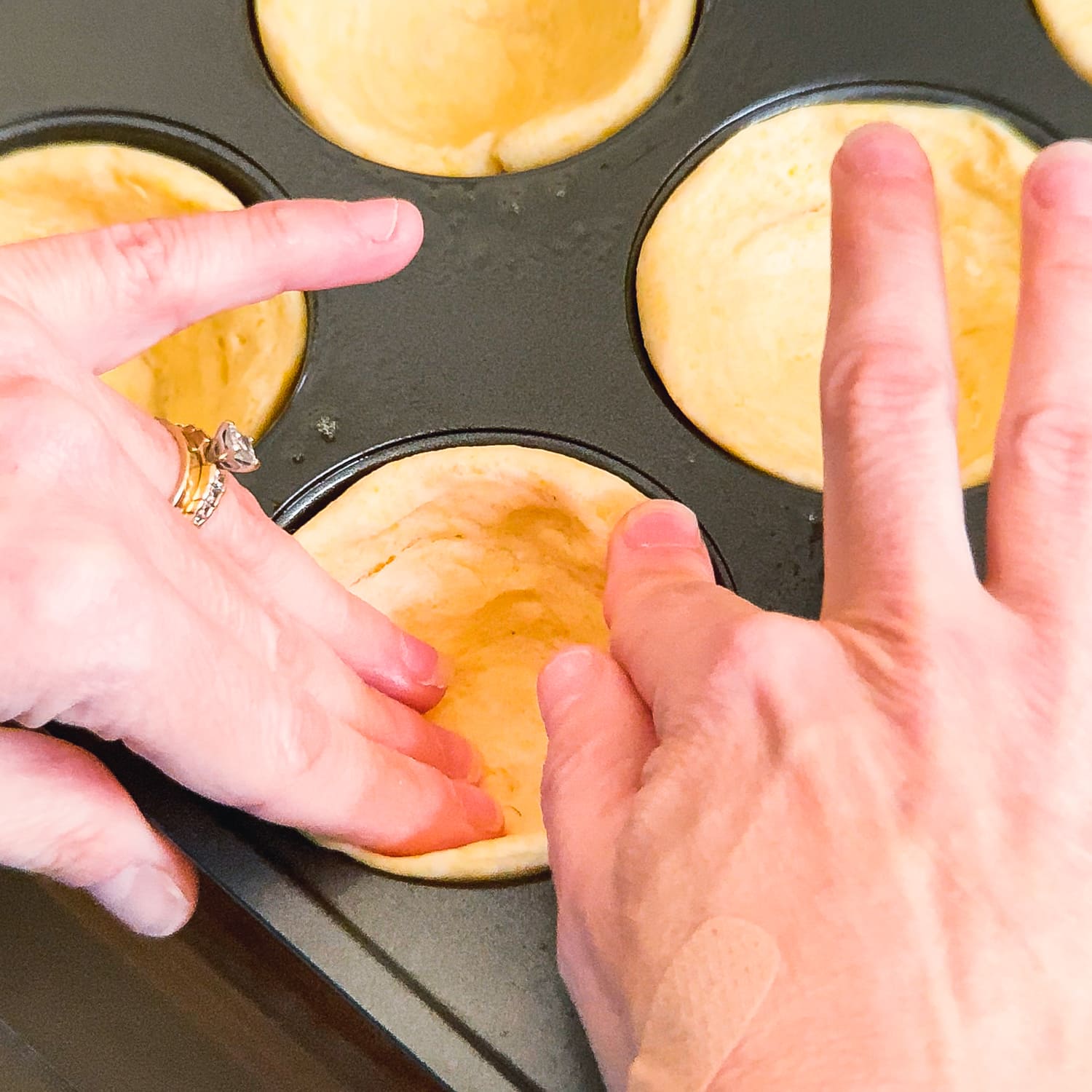 forming cups out of cornbread swirls