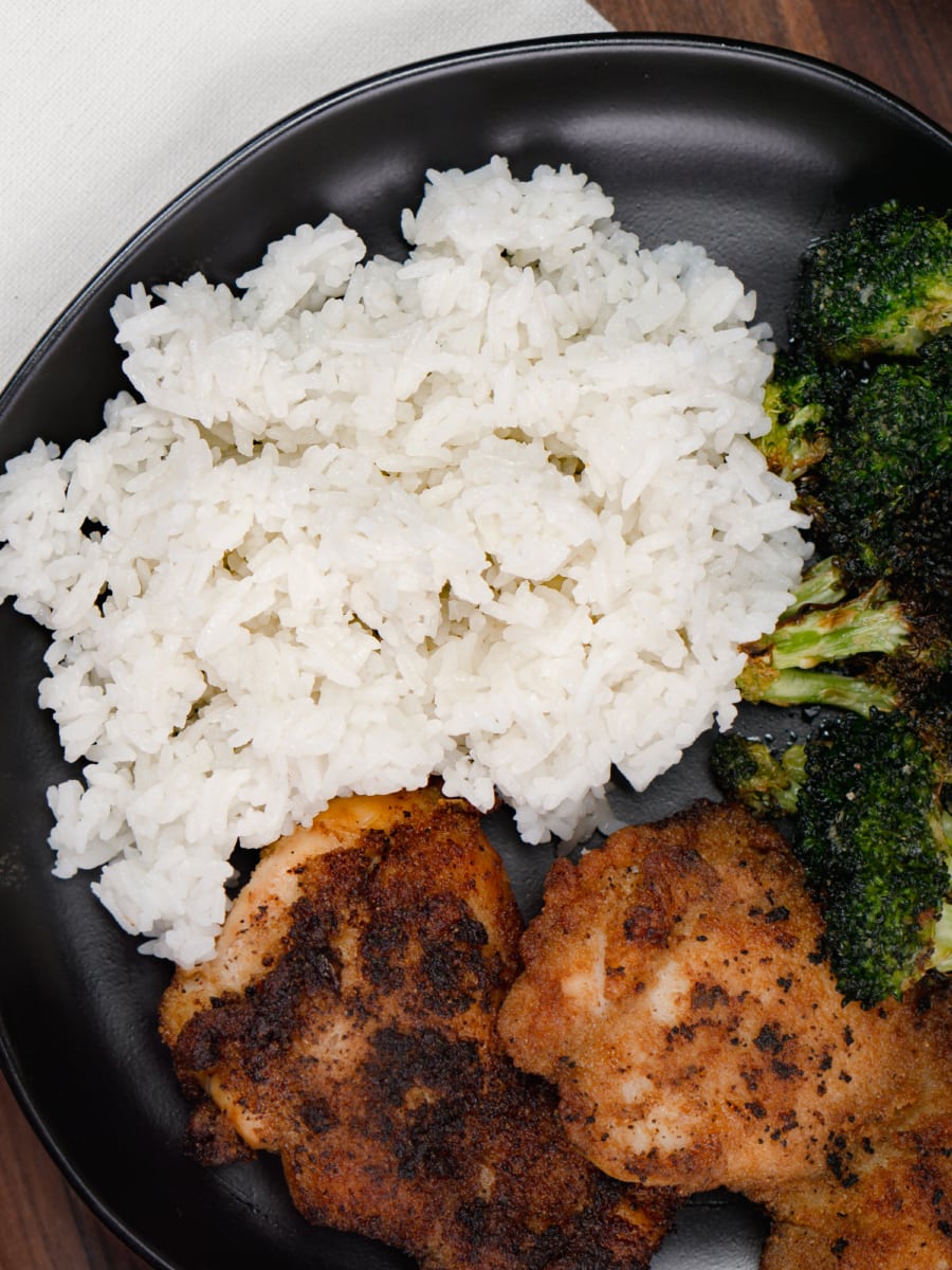 instant pot jasmine rice served on a plate with chicken thighs and broccoli