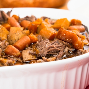 slow cooker pot roast made with beef roast yellow potatoes carrots and sweet potatoes