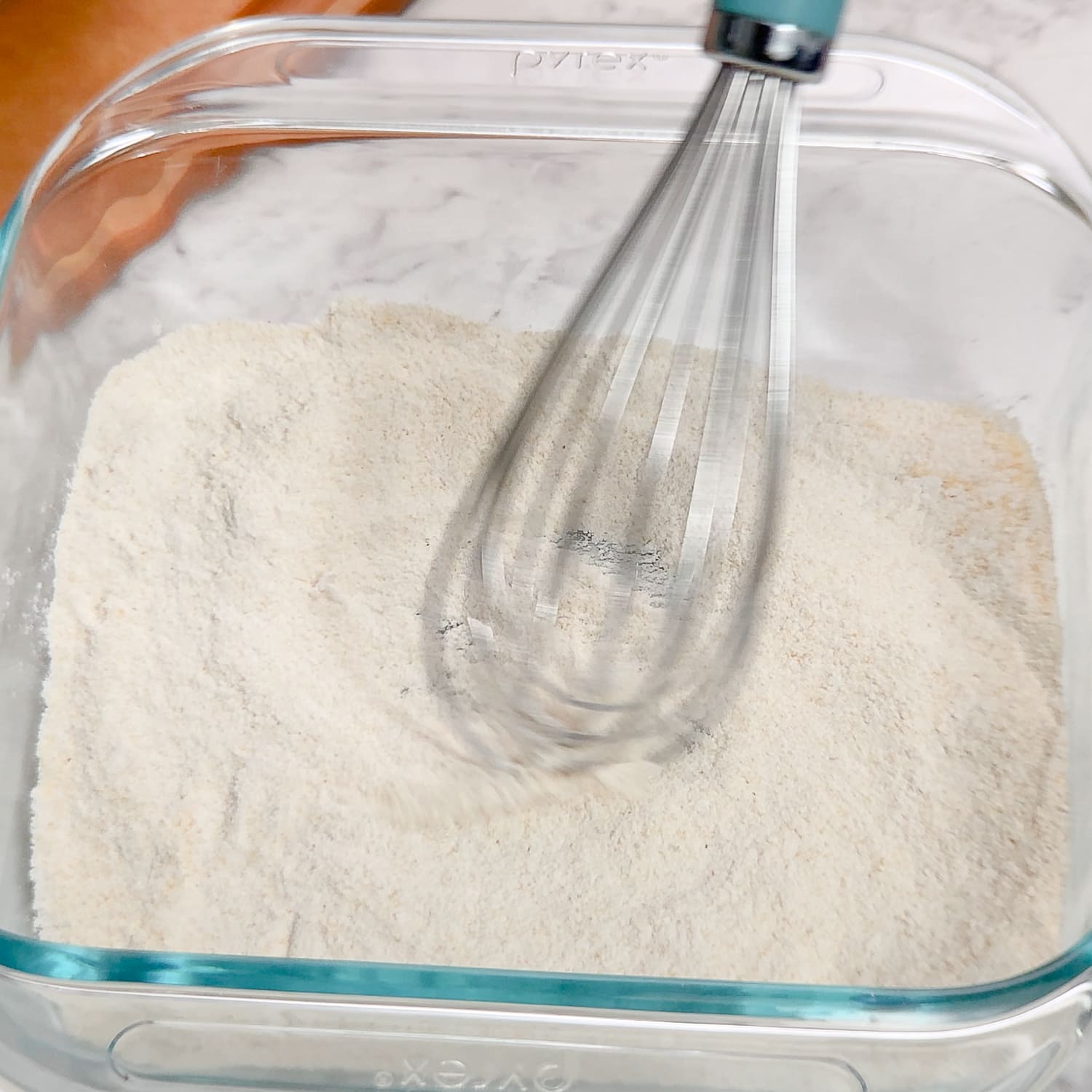 whisking a gluten-free breading mixture