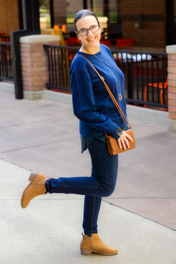 valerie standing in front of a restaurant showing off her winter fashion from Walmart