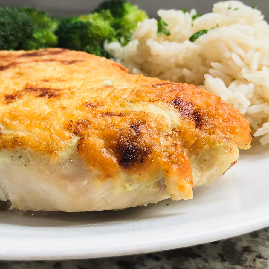 side view of creamy salsa verde chicken on a dinner plate