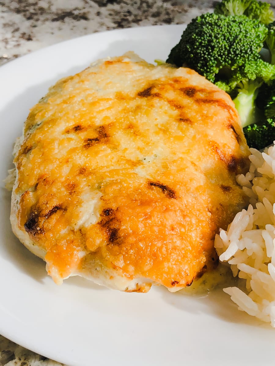 a creamy salsa verde chicken breast on a plate