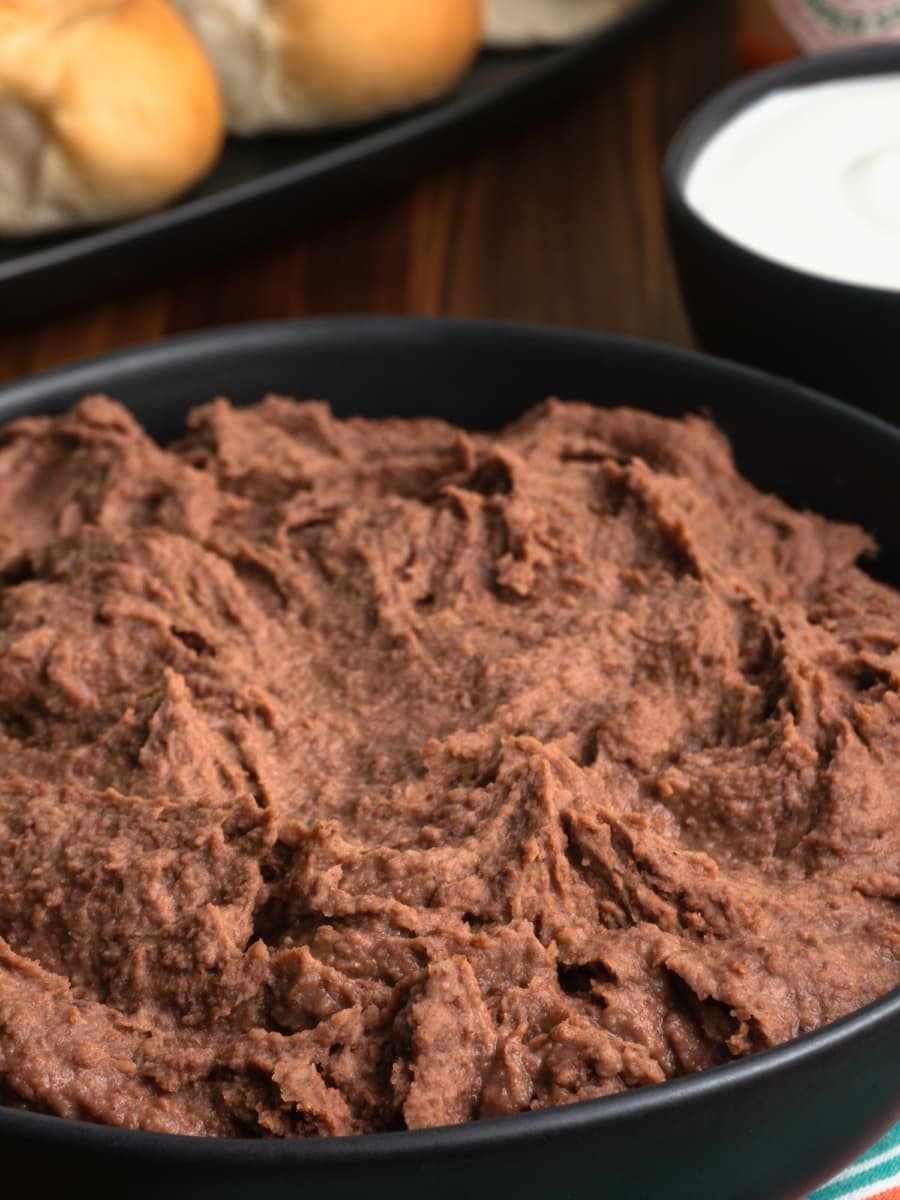 close up of a large bowl with homemade refried beans