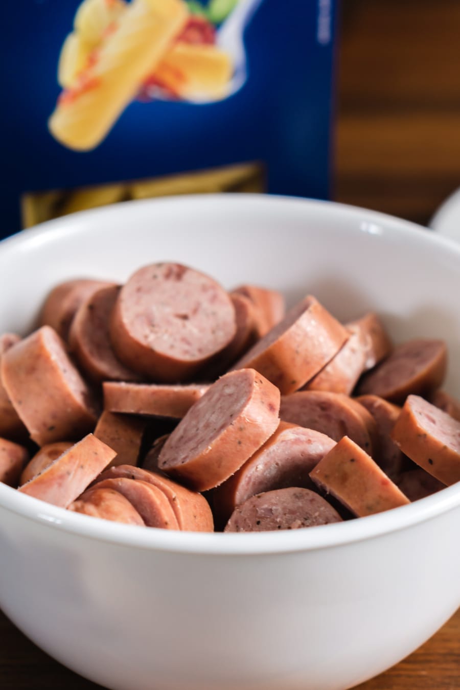 a bowl filled with slices of beef sausage