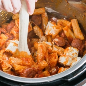 mixing cream cheese into cooked pasta and sausage in the instant pot