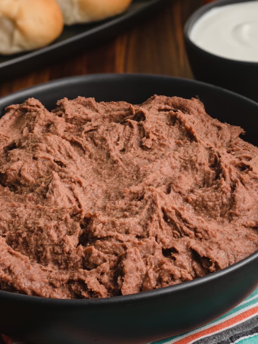 close up of refried beans in a large bowl