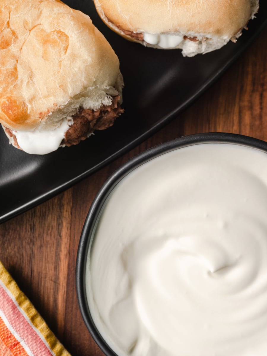 overhead shot of bread with honduran crema and refried beans 