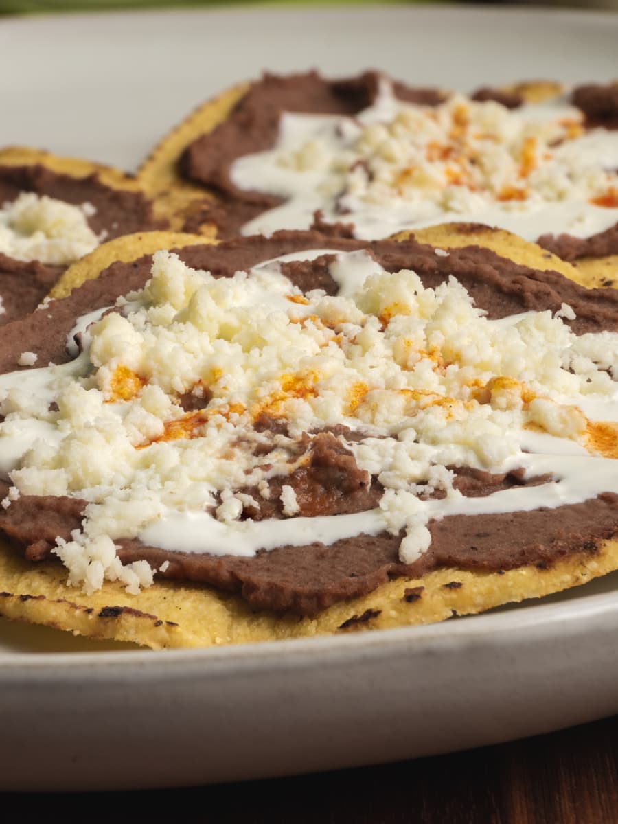 close up of bean tostadas on a large plate