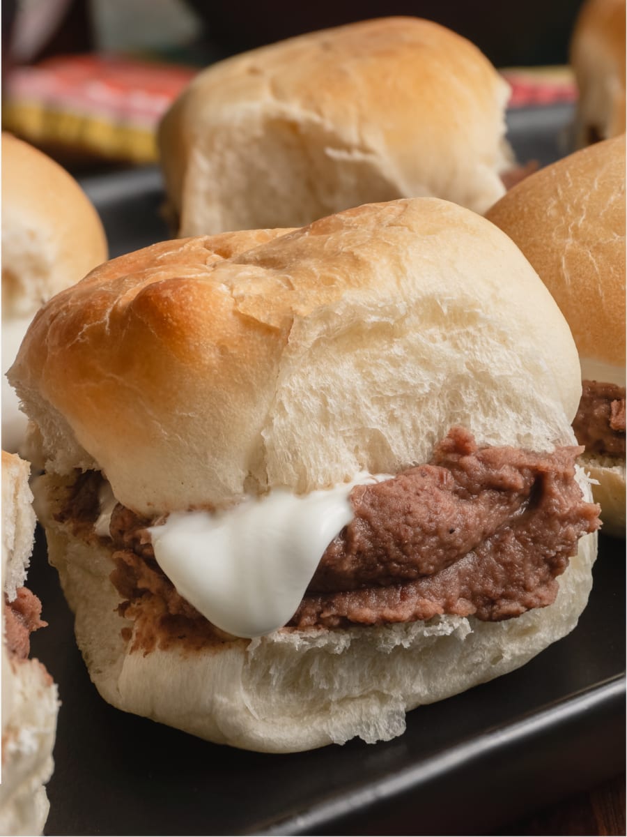 a close up of a tray with pan con frijoles or bread with beans