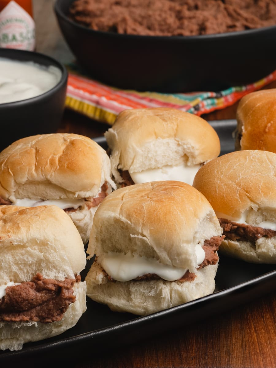 mantequilla dribbling out of the pan con frijoles or bread with beans 