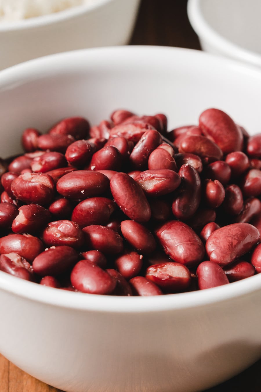 a small white prep bowl filled with dark red kidney beans